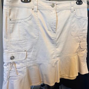 WHBM Khaki mini skirt with silver sun dries and brads.  Length 18”